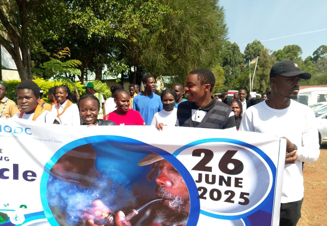 Youth holding a 26 June 2025 International Day Against Drug Abuse banner